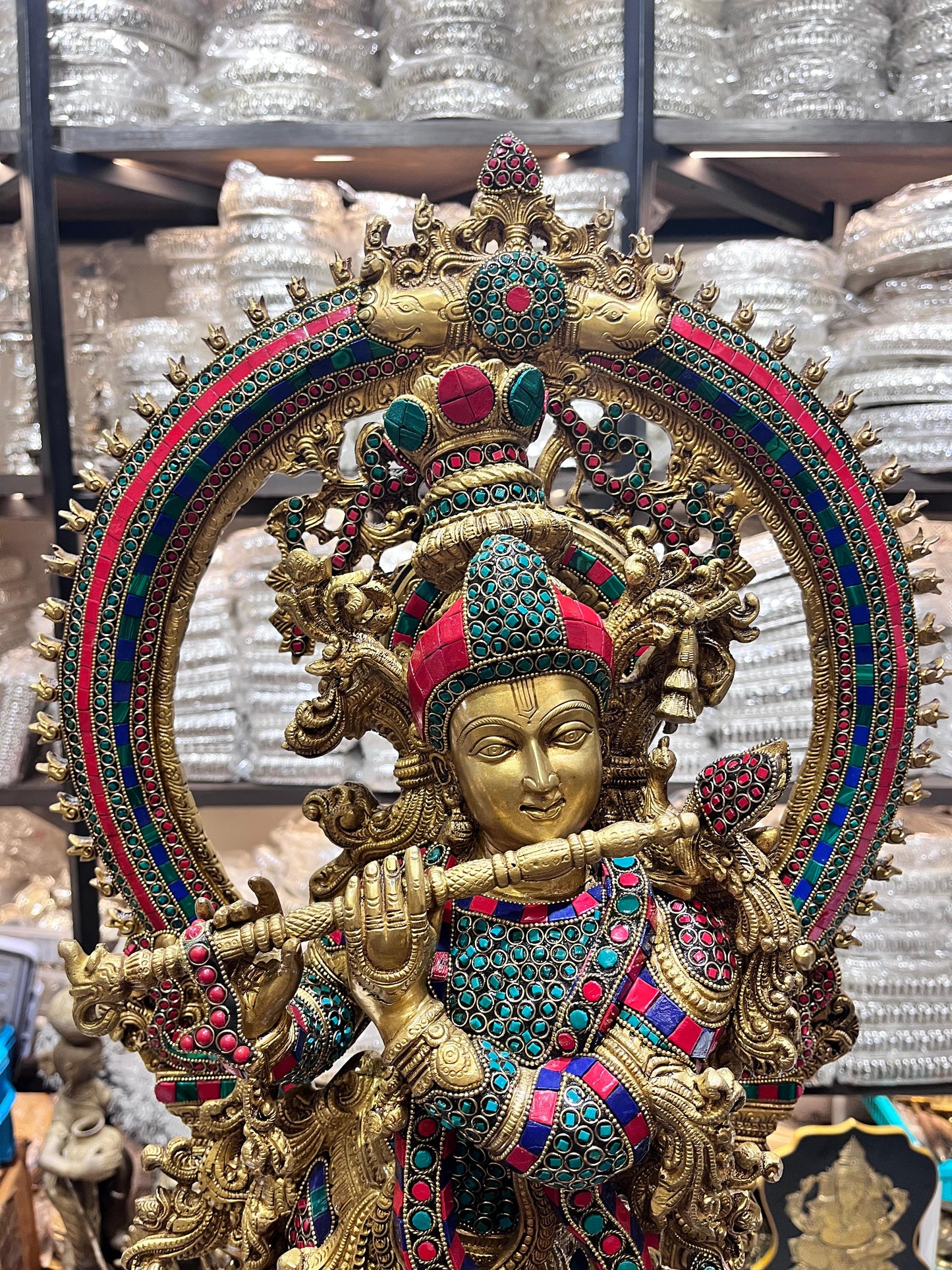 Divine Brass Krishna Statue with Intricate Stonework