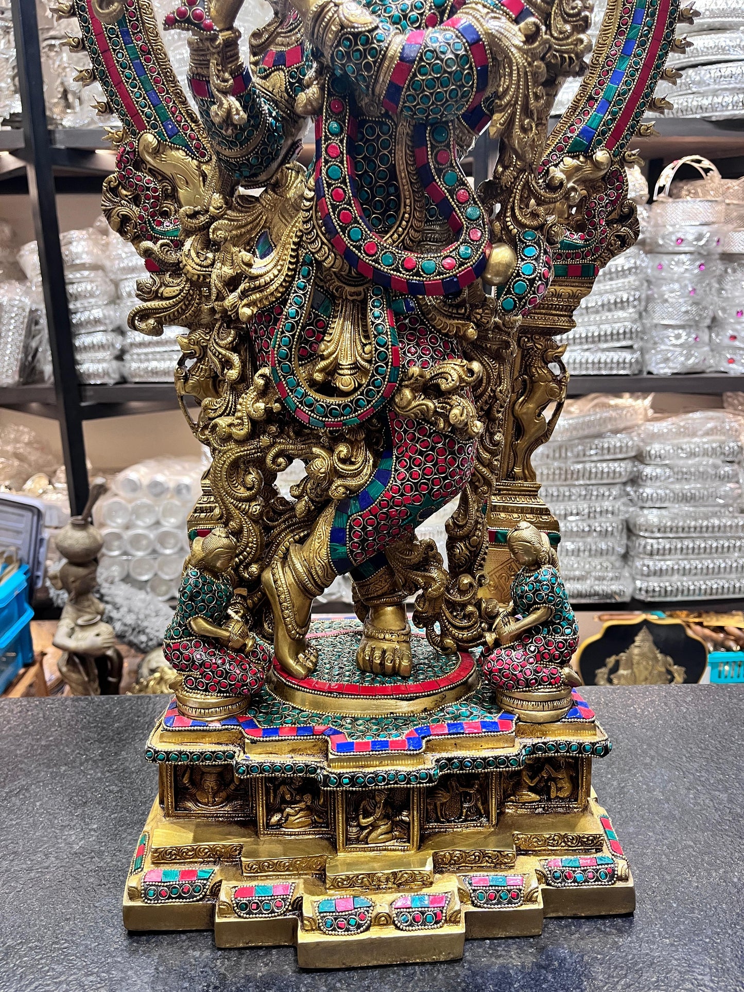 Divine Brass Krishna Statue with Intricate Stonework