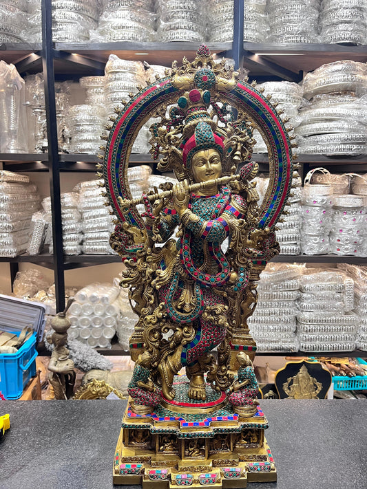 Divine Brass Krishna Statue with Intricate Stonework